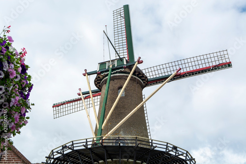 Old Dutch houses and traditional wind mill in Zierikzee, historical town in Zeeland, Netherlands