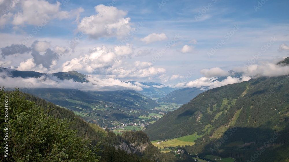 Beautiful view on Austrian valley with mountains and clouds 