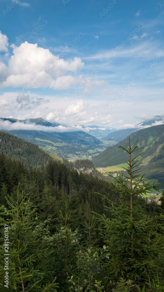 Mountains view in Austria with clouds and valley