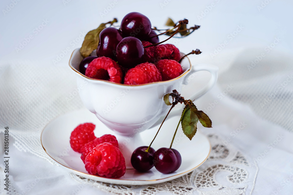 Cup with berries on white background Cup with berries on white background