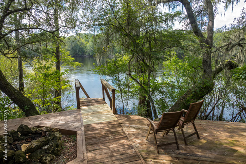 Chairs and fire pit on scenic Suwannee river deck overlook
