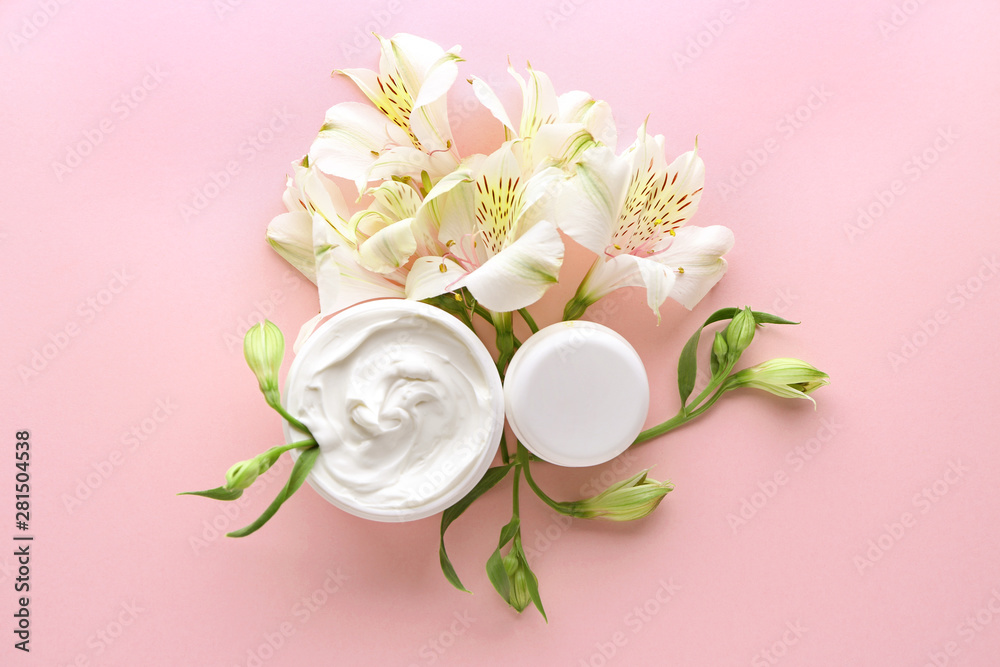 Natural cream with flowers on color background Natural cream with flowers on color background
