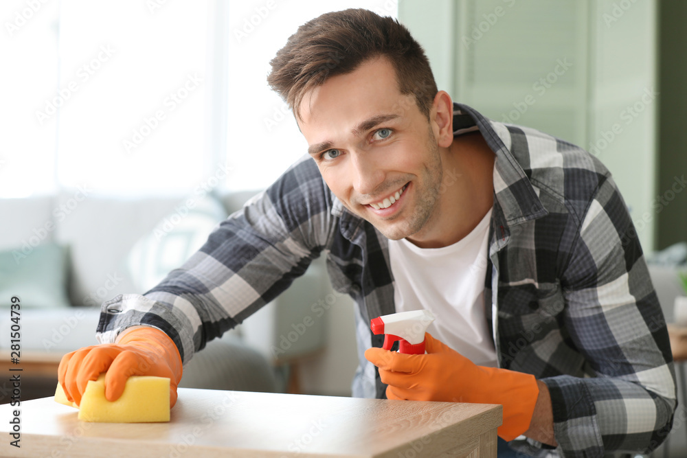 Young man cleaning his flat Young man cleaning his flat