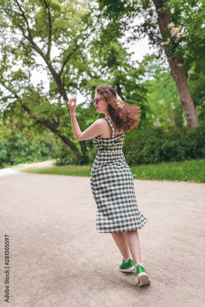 Happiness concept - happy woman having fun outdoors during summer Happiness concept - happy woman having fun outdoors during summer