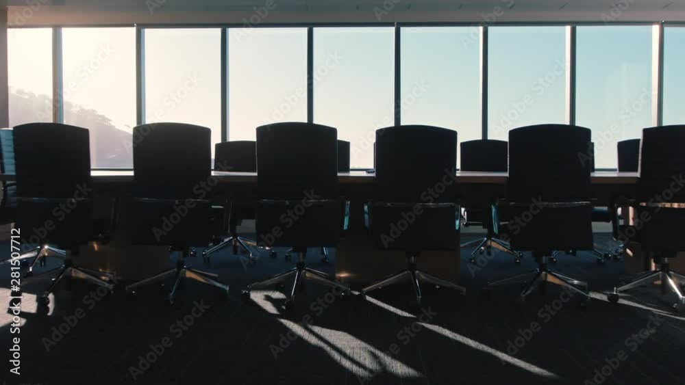 empty corporate office boardroom modern conference room with view of urban city at sunset 4k footage