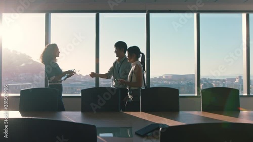 business people shaking hands consultant greeting international clients with handshake planning partnership deal female executive meeting shareholders in corporate office at sunset
