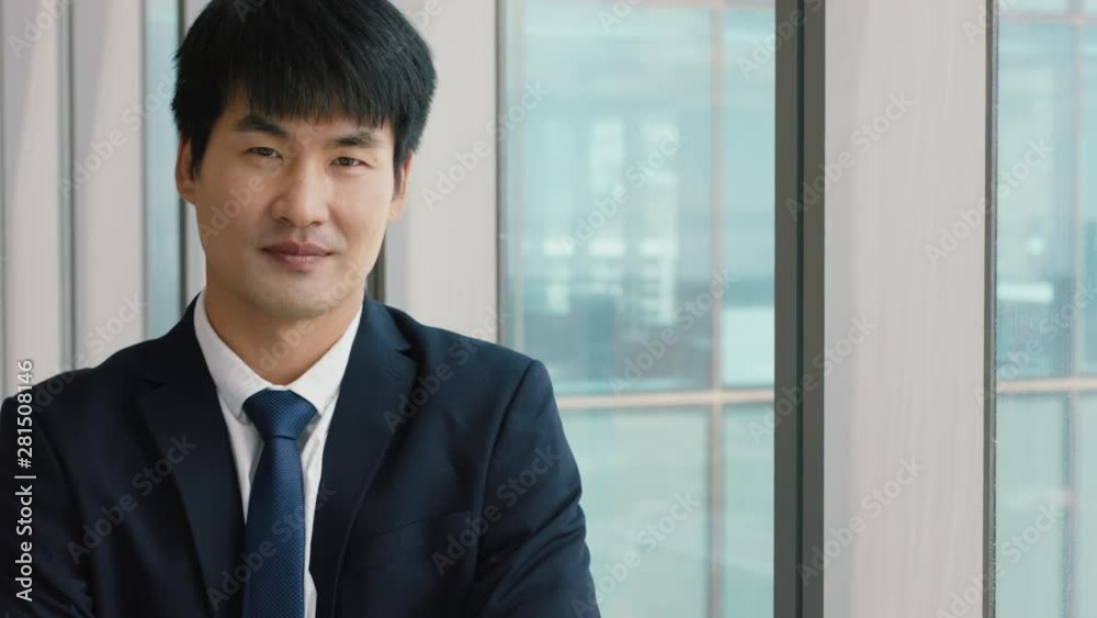 portrait asian businessman smiling confident male executive in office enjoying successful career in corporate leadership company manager at work portrait asian businessman smiling confident male executive in office enjoying successful career in corporate leadership company manager at work