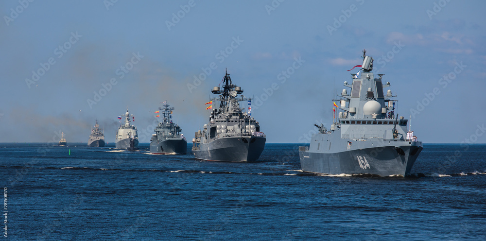 A line ahead of modern russian military naval battleships warships in the row, northern fleet and baltic sea fleet, summer sunny day A line ahead of modern russian military naval battleships warships in the row, northern fleet and baltic sea fleet, summer sunny day