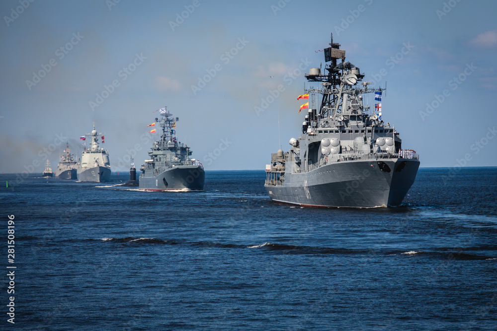 A line ahead of modern russian military naval battleships warships in the row, northern fleet and baltic sea fleet, summer sunny day