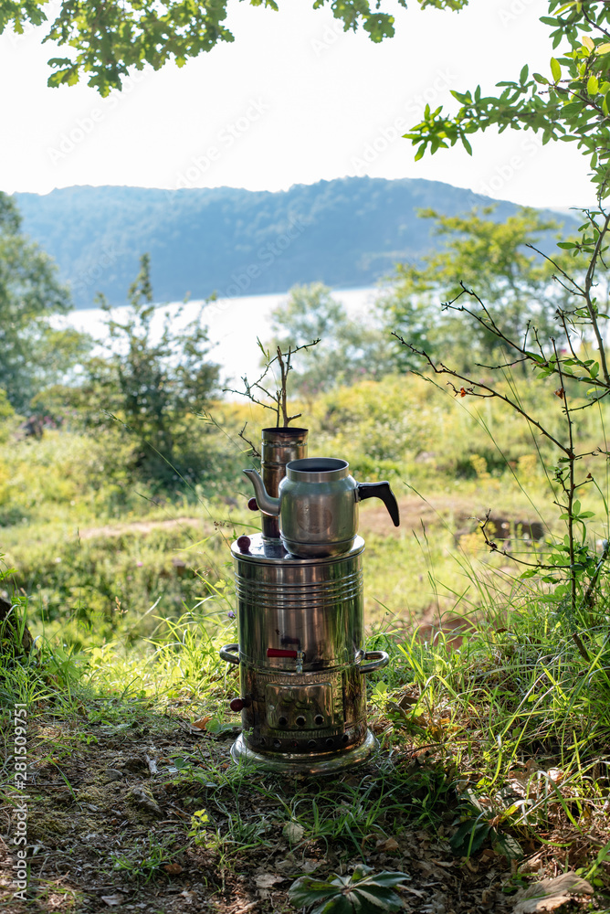 Enjoying tea in the samovar of the lake edge Enjoying tea in the samovar of the lake edge