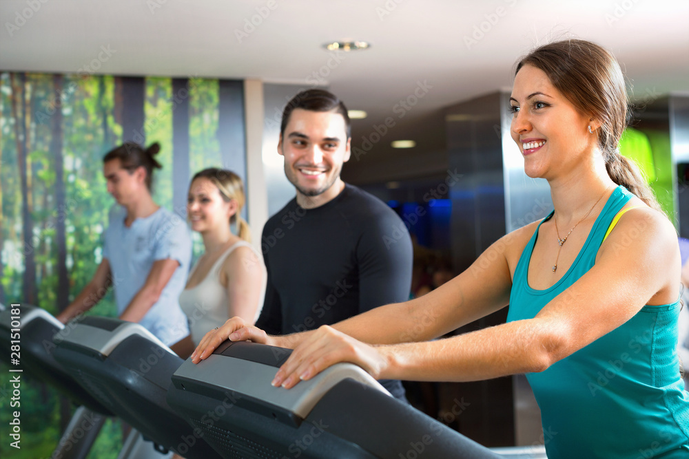 Group of people doing cardio on treadmills