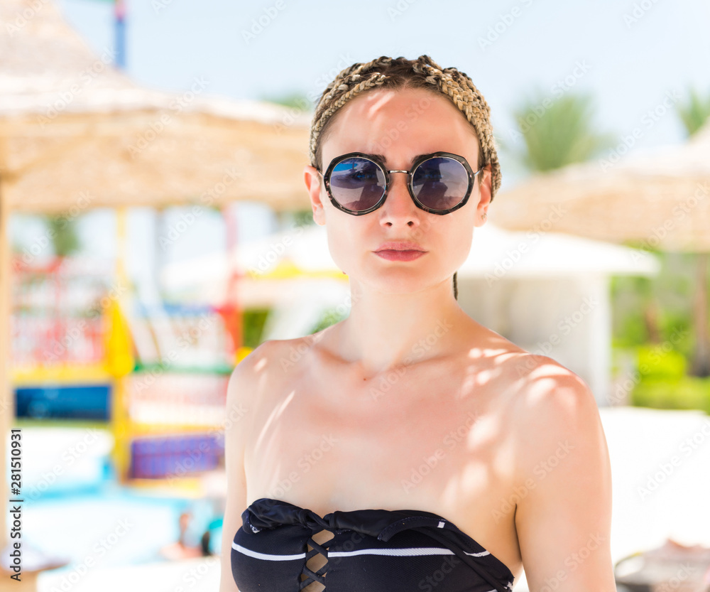 young caucasian woman portrait at summer seaside pool background young caucasian woman portrait at summer seaside pool background
