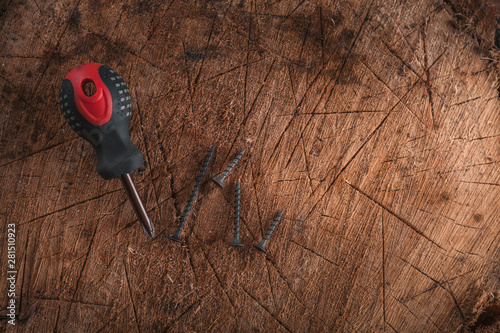 Phillips screwdriver on wooden background