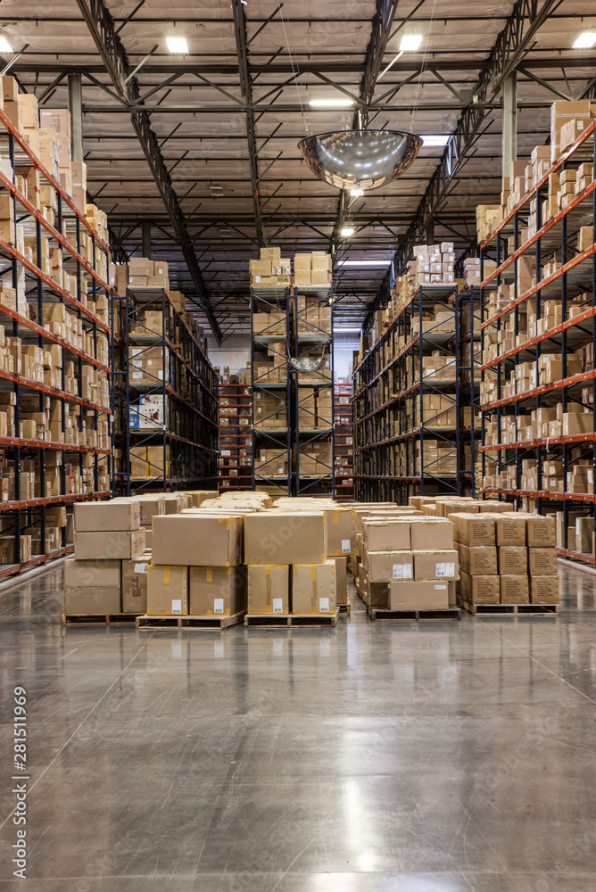 Cardboard boxes on pallets in distribution warehouse Cardboard boxes on pallets in distribution warehouse