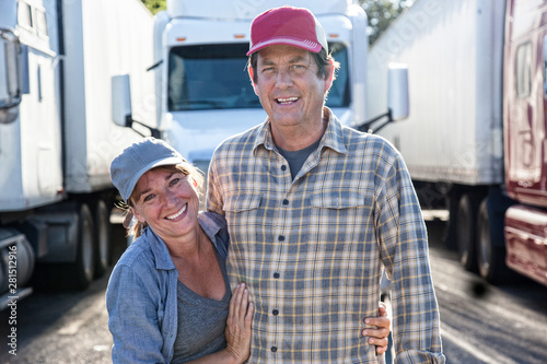 Portrait of couple standing at truck stop photo