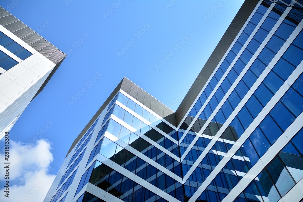 modern office building with blue sky and clouds modern office building with blue sky and clouds