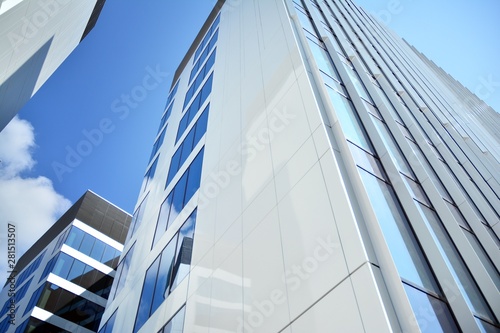 modern office building with blue sky and clouds © Grand Warszawski