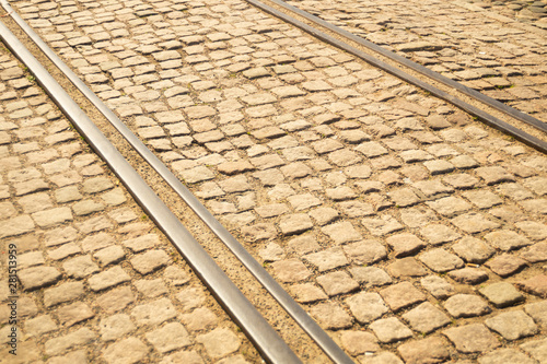 Brick texture. tram rails on stone pavement texture