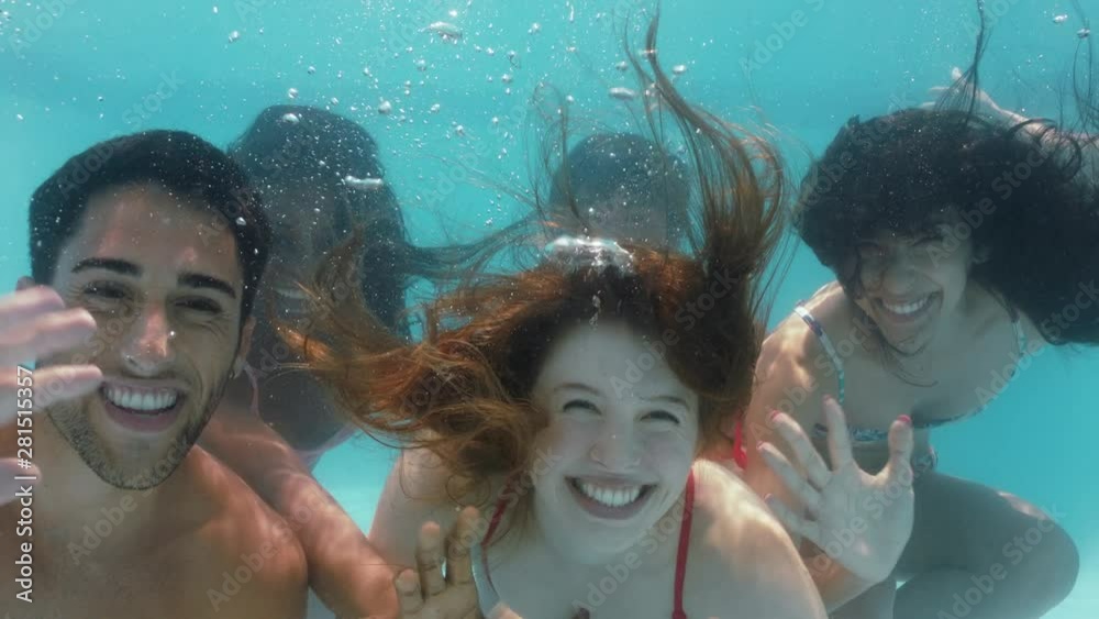 cool friends swimming underwater in pool waving having fun celebrating summer vacation together enjoying spring break pool party 4k