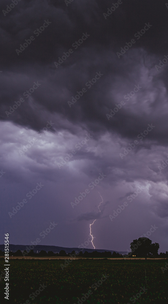 Dark Strong Thunder Clouds with Lighting Panorama View with field