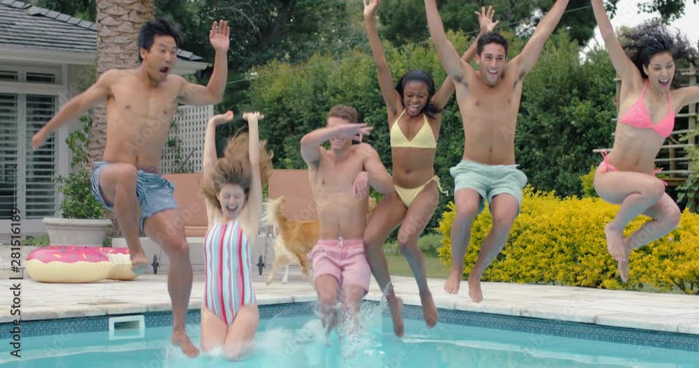 friends jumping in swimming pool having fun celebrating summer vacation together  group of teenagers enjoying pool party on sunny day spring break celebration 4k
