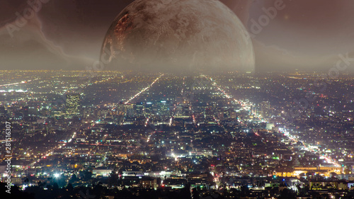 Large planet rising over city skyline in a futuristic world 