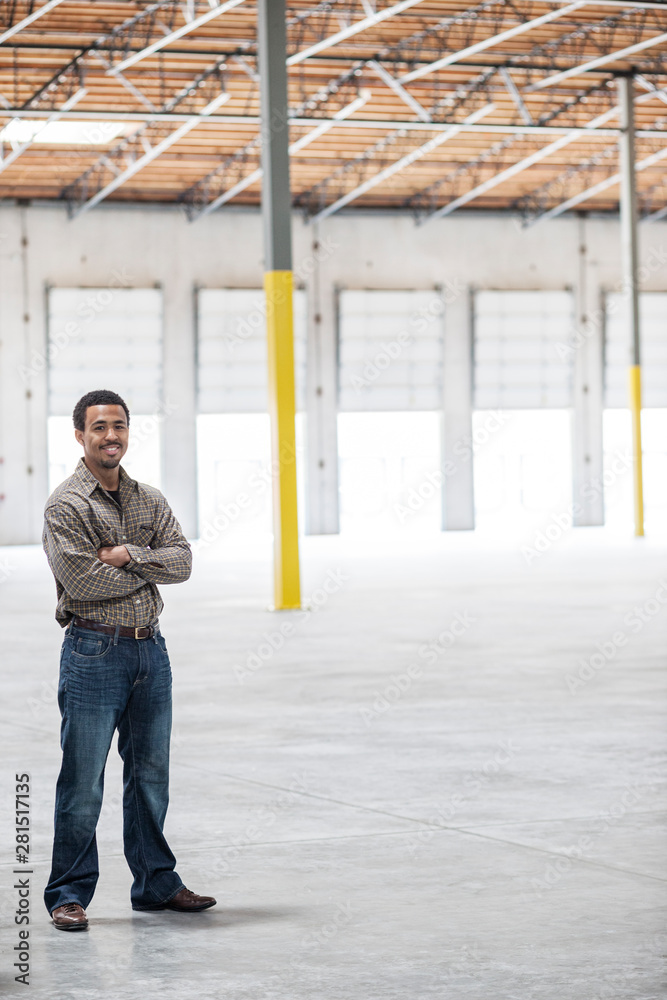 Portrait of architect standing in warehouse Portrait of architect standing in warehouse
