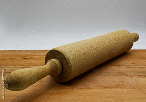  Wooden rolling pin, on wooden table, white background