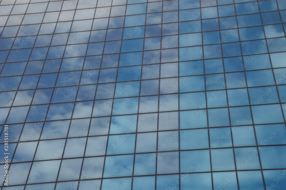Skyscrapers modern windows and mirrored sky in it Skyscrapers modern windows and mirrored sky in it