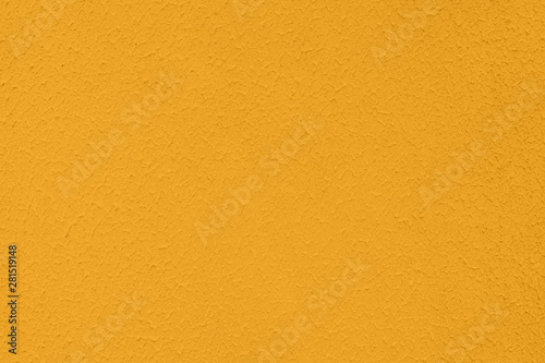 Saturated yellow colored low contrast Concrete textured background with roughness and irregularities to your concept or product.