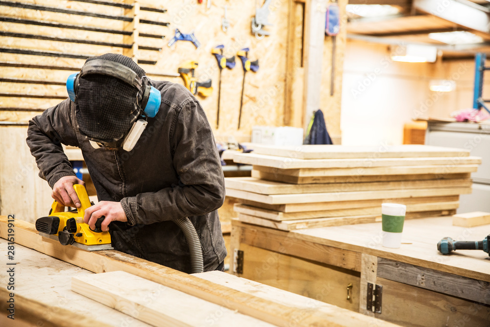 Carpenter working in warehouse Carpenter working in warehouse