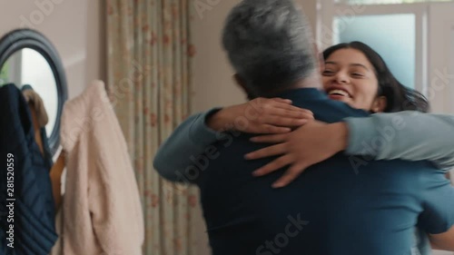 happy teenage girl hugging father congratulating daughter successful achievement excited dad feeling proud parent at home 4k photo