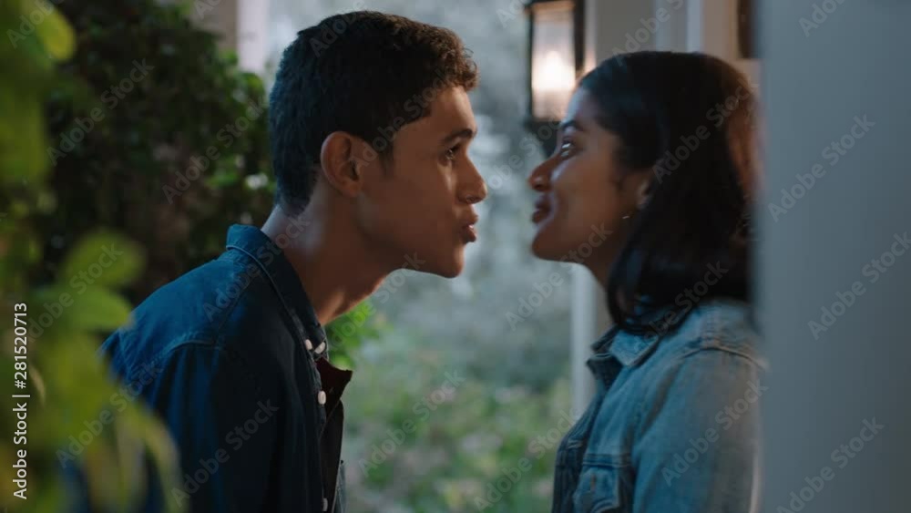 happy young couple first kiss beautiful teenage girl kissing boyfriend outside home enjoying romantic evening date 4k footage happy young couple first kiss beautiful teenage girl kissing boyfriend outside home enjoying romantic evening date 4k footage