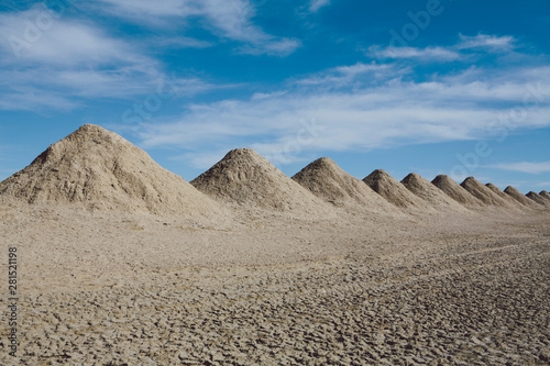 Heap of mining tailings in desert photo