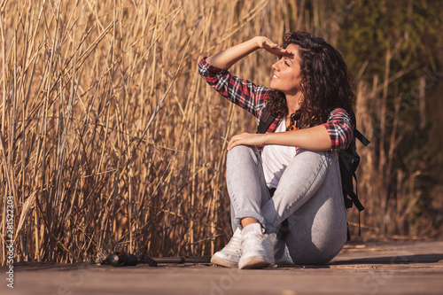 Woman enjoying autumn dayin nature photo