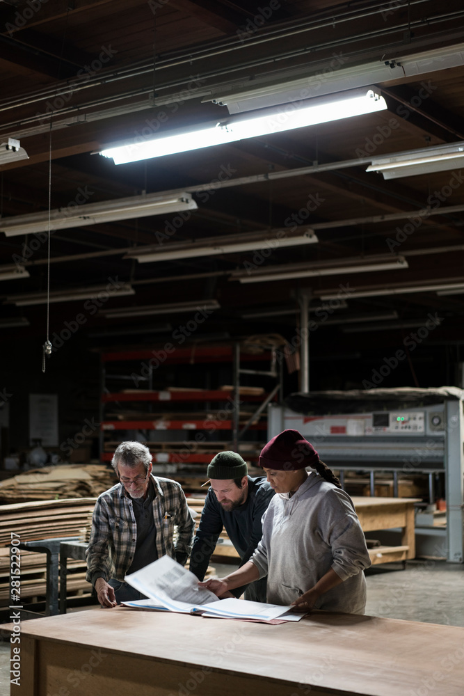Carpenters working in workshop Carpenters working in workshop