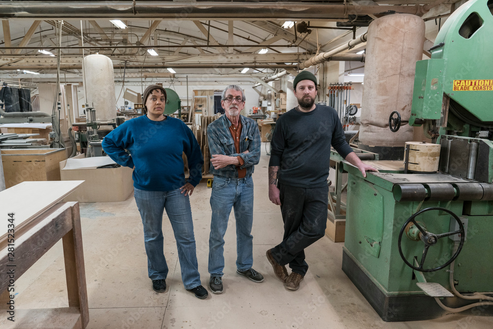 Portrait of carpenters standing in workshop Portrait of carpenters standing in workshop