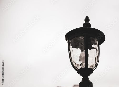 Lonely lamp against a gray background