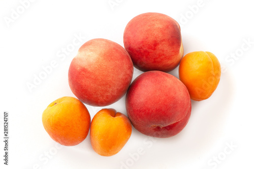 Fresh juicy peaches fruits and ripe apricots isolated on white background. Summer fruit concept. Close-up