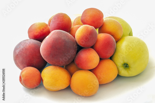 Fresh juicy peaches fruits, green apples and ripe apricots isolated on white background. Summer fruit concept. Close-up