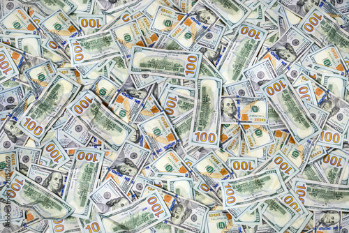 Pile of one hundred US dollar bills as background