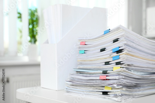 Table with lots of documents in office