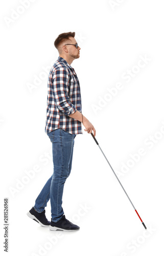 Blind man in dark glasses with walking cane on white background © New Africa