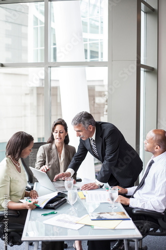Business people talking with each other during office meeting