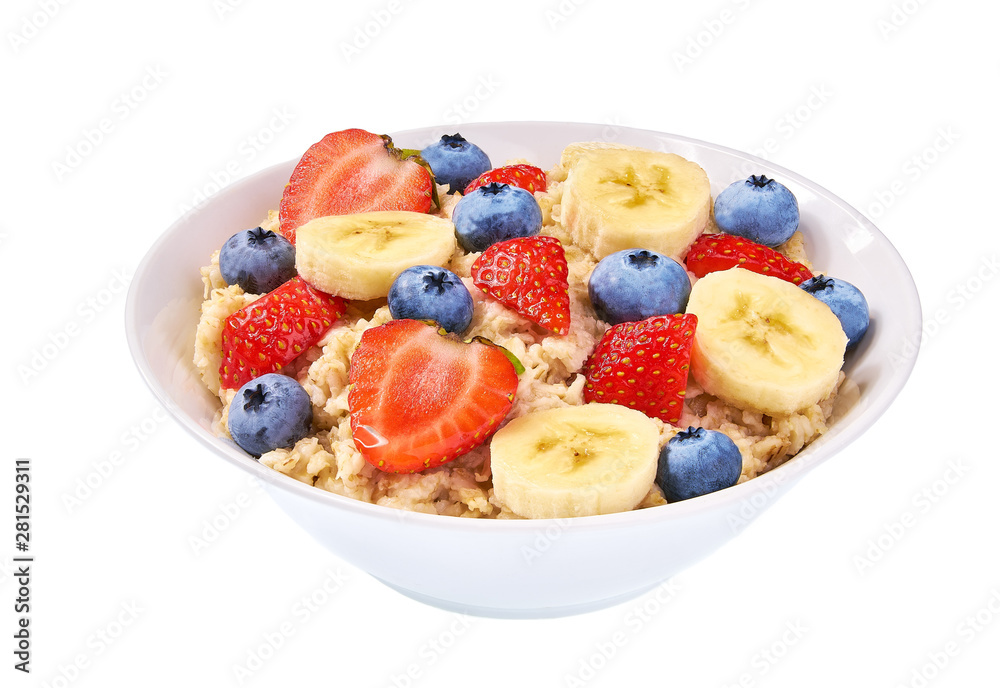 Bowl of oatmeal with berries, banana,blueberry and strawberry  on white background isolated.