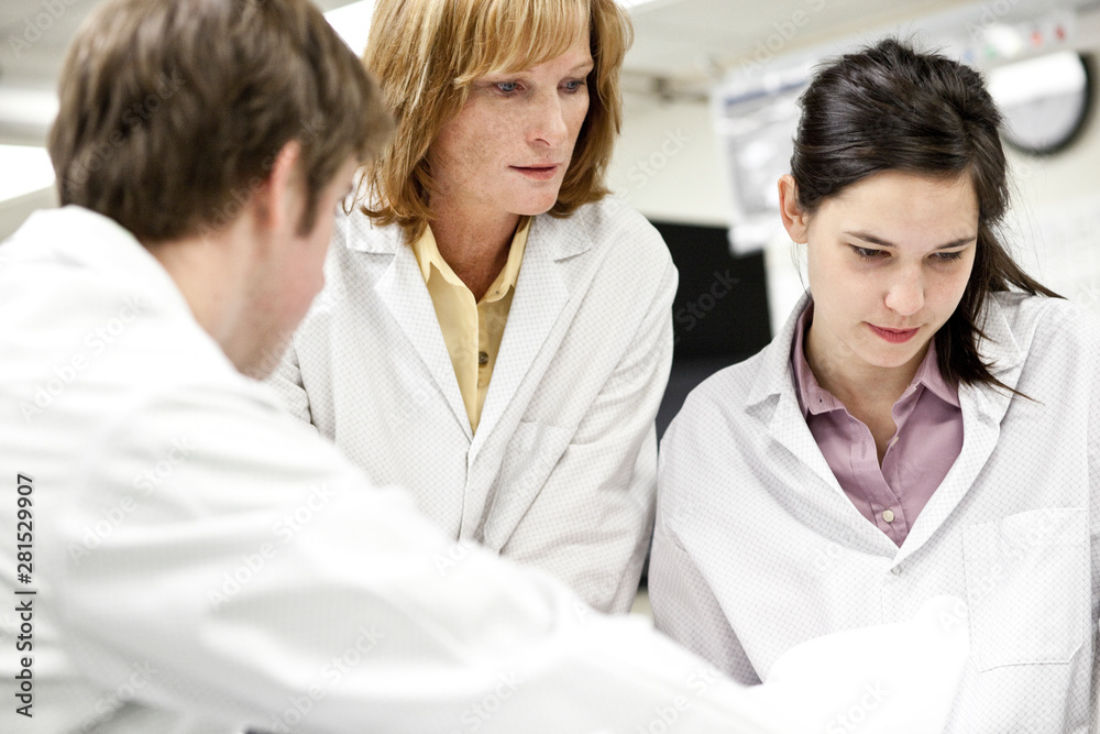 Technicians working in laboratory Technicians working in laboratory