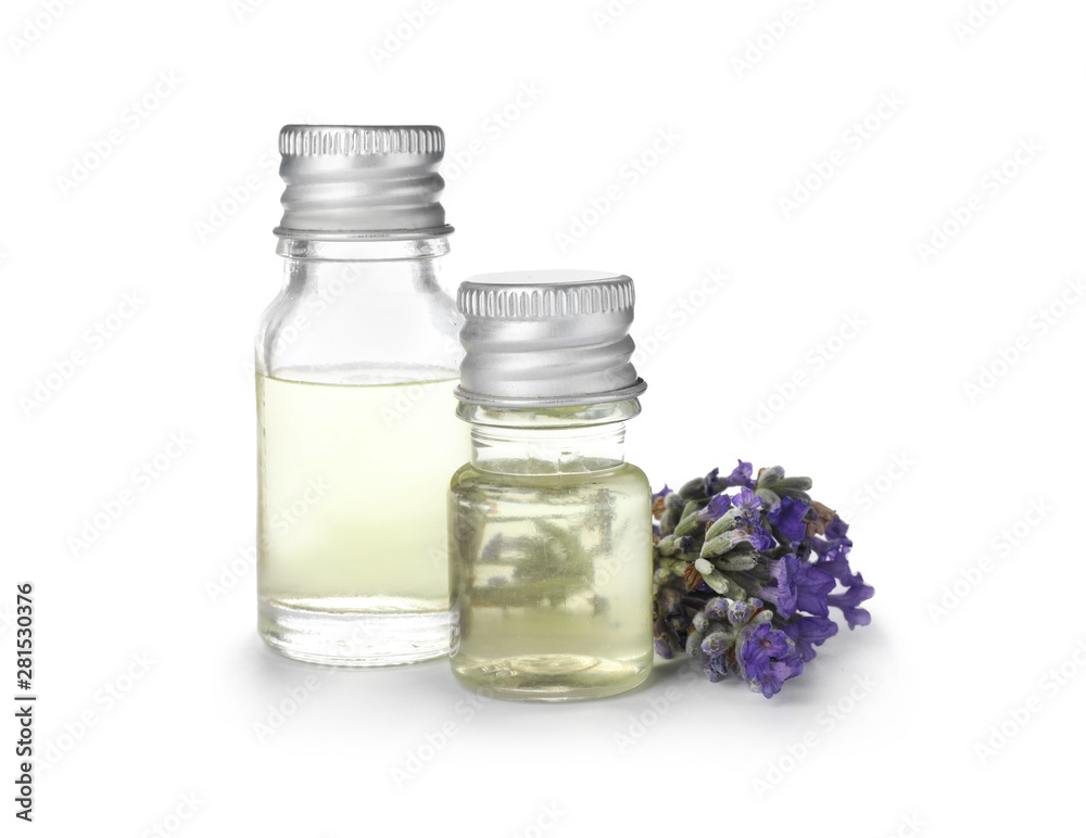 Bottles with natural lavender oil and flowers on white background Bottles with natural lavender oil and flowers on white background