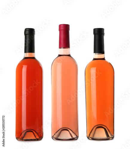 Bottles of delicious rose wine on white background. Mockup for design