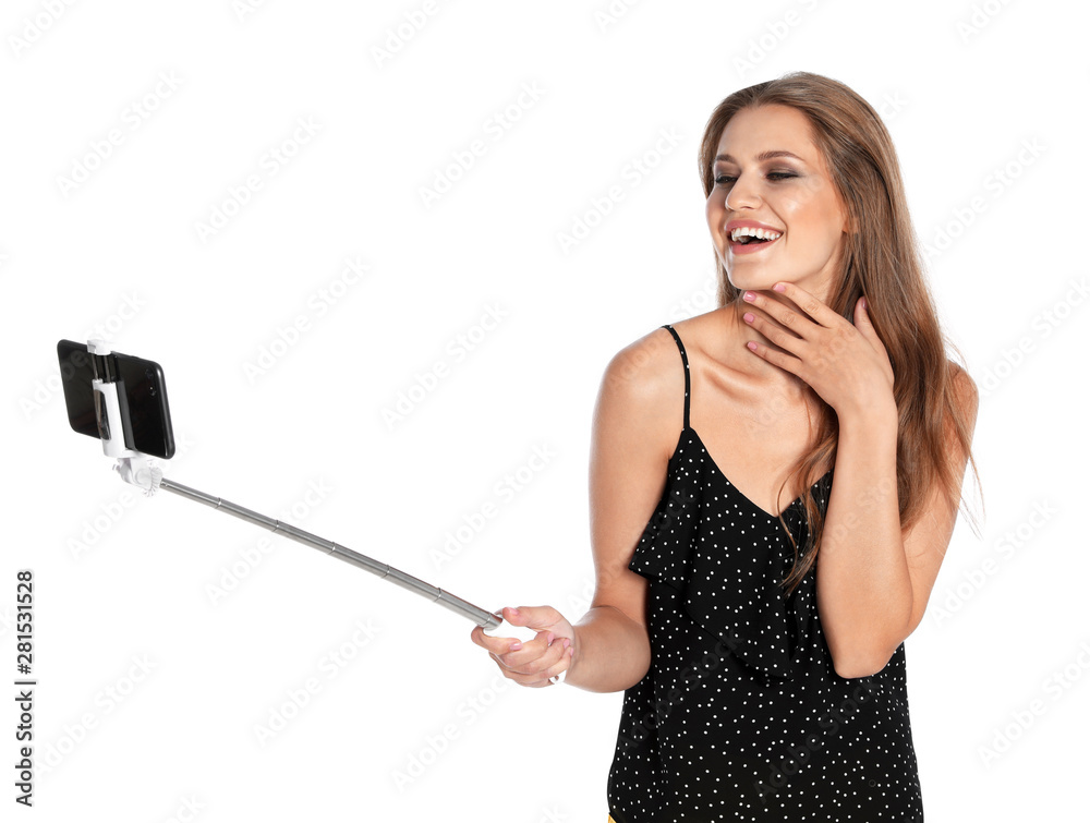 Happy young woman taking selfie on white background Happy young woman taking selfie on white background