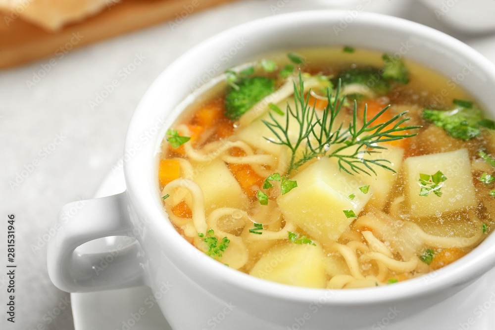 Dish of fresh homemade vegetable soup on table, closeup